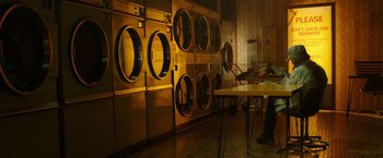 Movie still from “Predestination” (2014), directed by Michael Spierig – A bunch of machines that are in a room; Wide shot, Low angle