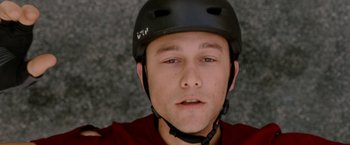Movie still from “Premium Rush” (2012), directed by David Koepp – A person wearing a helmet; Close Up shot, Overhead angle