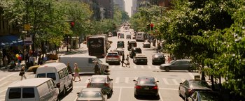 Movie still from “Premium Rush” (2012), directed by David Koepp – A city street filled with lots of traffic; Extreme Wide shot, High angle