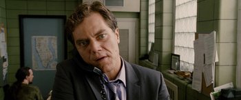 Movie still from “Premium Rush” (2012), directed by David Koepp – A person talking on a phone; Close Up shot, Low angle