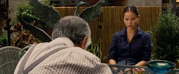 Movie still from “Premium Rush” (2012), directed by David Koepp – A man and a woman sitting in front of each other; Medium shot, Over the shoulder angle