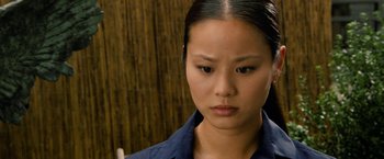 Movie still from “Premium Rush” (2012), directed by David Koepp – A person wearing a blue shirt; Close Up shot, High angle