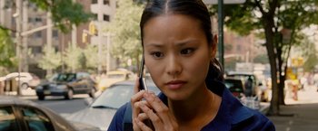 Movie still from “Premium Rush” (2012), directed by David Koepp – A woman is talking on a cell phone; Close Up shot, High angle