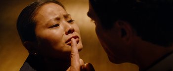 Movie still from “Premium Rush” (2012), directed by David Koepp – A man touching a womans face with her finger; Close Up shot, Over the shoulder angle