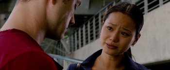 Movie still from “Premium Rush” (2012), directed by David Koepp – A man and a woman looking at one another; Close Up shot, Over the shoulder angle