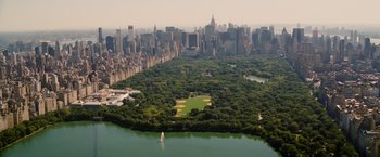 Movie still from “Premium Rush” (2012), directed by David Koepp – An aerial view of a park and a large city; Extreme Wide shot, High angle
