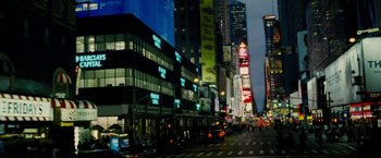 Movie still from “Premium Rush” (2012), directed by David Koepp – A street view of a busy city at night time; Extreme Wide shot, High angle