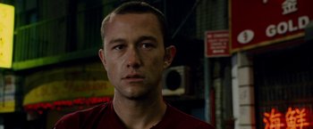 Movie still from “Premium Rush” (2012), directed by David Koepp – A person wearing a red shirt; Close Up shot, Over the shoulder angle
