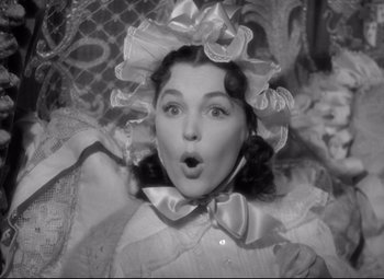 Movie still from “Pride and Prejudice” (1940), directed by Robert Z. Leonard – A black - and - white photo of a woman with a surprised look on her face; Close Up shot, Low angle