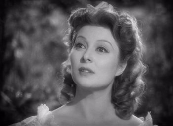 Movie still from “Pride and Prejudice” (1940), directed by Robert Z. Leonard – An old black and white photo of a woman; Close Up shot, High angle