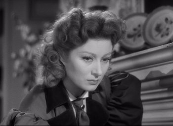 Movie still from “Pride and Prejudice” (1940), directed by Robert Z. Leonard – An old black and white photo of a woman; Close Up shot, High angle