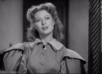 Movie still from “Pride and Prejudice” (1940), directed by Robert Z. Leonard – A black - and - white photo of a woman in a dress; Close Up shot, Over the shoulder angle