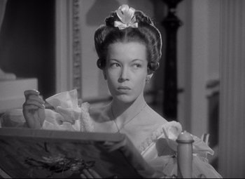 Movie still from “Pride and Prejudice” (1940), directed by Robert Z. Leonard – A black and white photo of a woman in a victorian dress; Close Up shot, Low angle