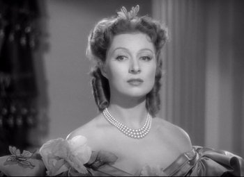 Movie still from “Pride and Prejudice” (1940), directed by Robert Z. Leonard – A black - and - white photo of a woman in a dress; Close Up shot, Low angle