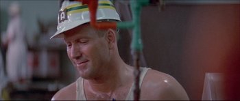 Movie still from “Prime Cut” (1972), directed by Michael Ritchie – A person wearing a hat; Close Up shot, Low angle