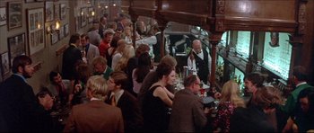 Movie still from “Prime Cut” (1972), directed by Michael Ritchie – A crowd of people sitting at tables in a restaurant; Wide shot, High angle