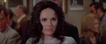 Movie still from “Prime Cut” (1972), directed by Michael Ritchie – A person with long hair; Close Up shot, Over the shoulder angle