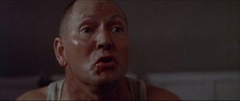 Movie still from “Prime Cut” (1972), directed by Michael Ritchie – A person with a mouth wide open; Close Up shot, Low angle