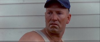 Movie still from “Prime Cut” (1972), directed by Michael Ritchie – A person wearing a hat; Close Up shot, Low angle