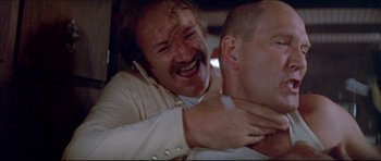 Movie still from “Prime Cut” (1972), directed by Michael Ritchie – A man is hugging another man in a car; Close Up shot, Low angle