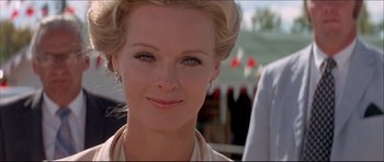 Movie still from “Prime Cut” (1972), directed by Michael Ritchie – A woman's face in a white shirt; Close Up shot, Low angle