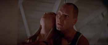 Movie still from “Prime Cut” (1972), directed by Michael Ritchie – A man and a woman looking at each other; Close Up shot, Low angle