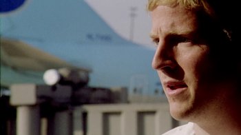 Movie still from “Primer” (2004), directed by Shane Carruth – A man's face in a white shirt; Close Up shot, Low angle