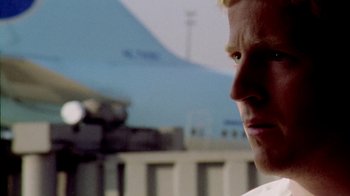 Movie still from “Primer” (2004), directed by Shane Carruth – A man's face with a blue sky in the background; Close Up shot, Low angle