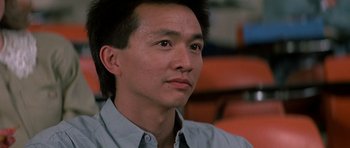 Movie still from “Prince of Darkness” (1987), directed by John Carpenter – A person wearing a blue shirt; Close Up shot, Low angle