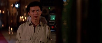 Movie still from “Prince of Darkness” (1987), directed by John Carpenter – A man standing in front of a green screen; Close Up shot, Low angle