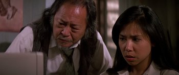 Movie still from “Prince of Darkness” (1987), directed by John Carpenter – An older man and a younger woman looking at each other; Close Up shot, Over the shoulder angle