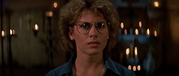 Movie still from “Prince of Darkness” (1987), directed by John Carpenter – A person wearing glasses; Close Up shot, Low angle