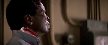 Movie still from “Prince of Darkness” (1987), directed by John Carpenter – A person looking up at something; Close Up shot, Low angle