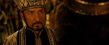 Movie still from “Prince of Persia: The Sands of Time” (2010), directed by Mike Newell – A person wearing a crown; Close Up shot, Over the shoulder angle