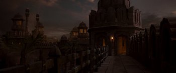 Movie still from “Prince of Persia: The Sands of Time” (2010), directed by Mike Newell – A view of a castle at night from a walkway; Extreme Wide shot, Low angle