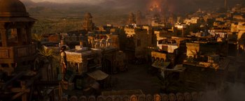 Movie still from “Prince of Persia: The Sands of Time” (2010), directed by Mike Newell – An image of an old town with a fire in the background; Extreme Wide shot, High angle