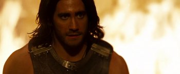 Movie still from “Prince of Persia: The Sands of Time” (2010), directed by Mike Newell – A man with long black hair; Close Up shot, Over the shoulder angle