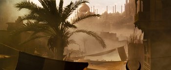 Movie still from “Prince of Persia: The Sands of Time” (2010), directed by Mike Newell – A palm tree in front of an egyptian city; Extreme Wide shot, Low angle