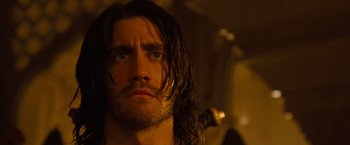 Movie still from “Prince of Persia: The Sands of Time” (2010), directed by Mike Newell – Close up of a man with long wet hair; Close Up shot, Low angle