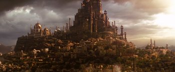 Movie still from “Prince of Persia: The Sands of Time” (2010), directed by Mike Newell – A castle like building with a lot of buildings on top of it; Extreme Wide shot, Low angle
