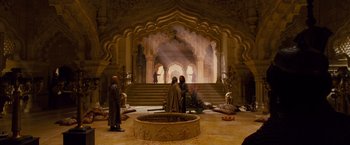 Movie still from “Prince of Persia: The Sands of Time” (2010), directed by Mike Newell – Two people are standing in an ornate room; Extreme Wide shot, High angle