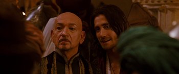 Movie still from “Prince of Persia: The Sands of Time” (2010), directed by Mike Newell – A man and a woman are standing next to each other; Close Up shot, Over the shoulder angle