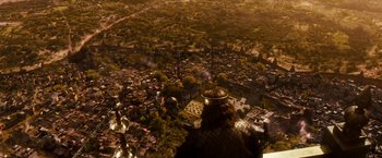 Movie still from “Prince of Persia: The Sands of Time” (2010), directed by Mike Newell – An aerial view of a city with a man in a helmet; Extreme Wide shot, High angle