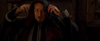 Movie still from “Prince of Persia: The Sands of Time” (2010), directed by Mike Newell – A person wearing a hooded cloak; Close Up shot, Low angle