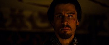 Movie still from “Prince of Persia: The Sands of Time” (2010), directed by Mike Newell – A person with a scar on his face; Close Up shot, Over the shoulder angle