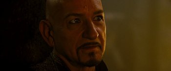 Movie still from “Prince of Persia: The Sands of Time” (2010), directed by Mike Newell – A man with a shaved head and a goatee; Close Up shot, Over the shoulder angle