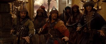 Movie still from “Prince of Persia: The Sands of Time” (2010), directed by Mike Newell – A group of men standing next to each other; Medium shot, Over the shoulder angle