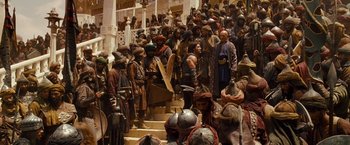 Movie still from “Prince of Persia: The Sands of Time” (2010), directed by Mike Newell – A group of people standing on steps in a building; Wide shot, High angle