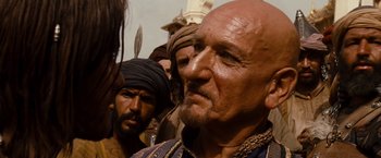 Movie still from “Prince of Persia: The Sands of Time” (2010), directed by Mike Newell – A group of men standing next to each other; Close Up shot, Over the shoulder angle