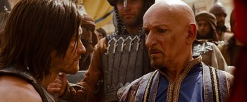 Movie still from “Prince of Persia: The Sands of Time” (2010), directed by Mike Newell – A man and a woman in medieval garb looking intently at each other; Close Up shot, Over the shoulder angle
